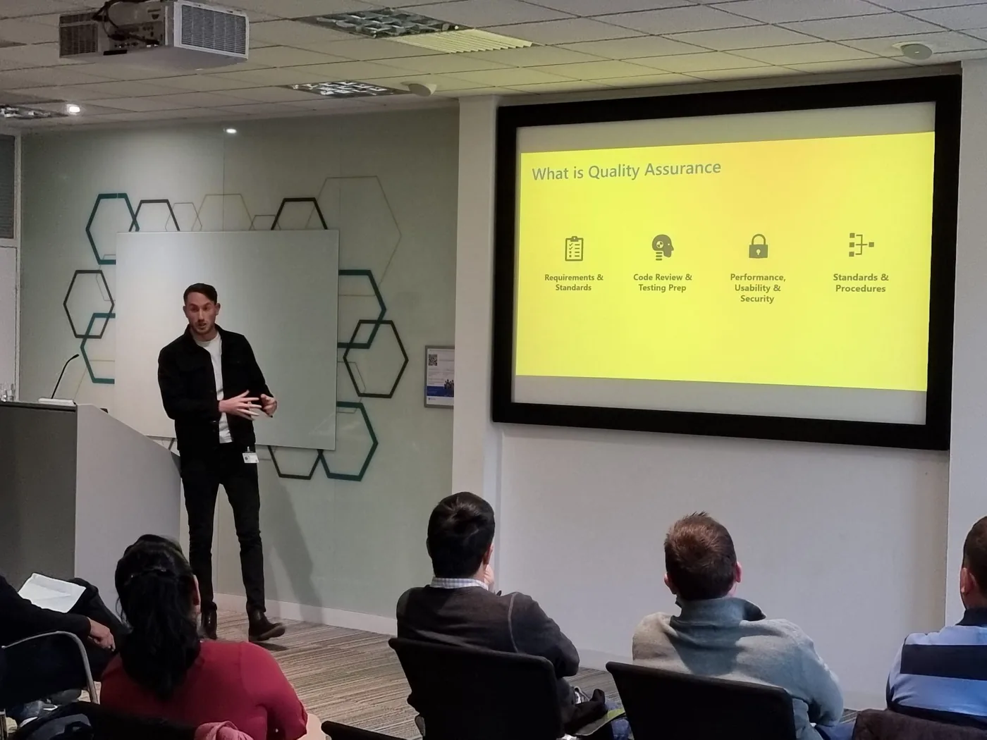 Presenting a session on quality assurance to an audience